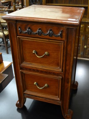 Lot 1214 - A carved hardwood chest, modern, with two drawers above scrolled feet, 38cm by 34cm by 61cm