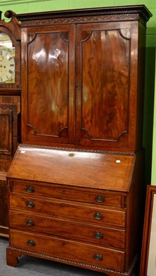 Lot 1236 - A George III inlaid mahogany bureau bookcase