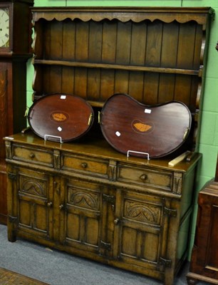 Lot 1240 - A Titchmarsh & Goodwin style oak dresser and rack