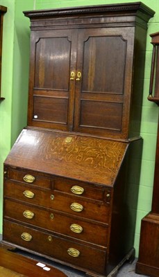 Lot 1242 - A 19th century oak and mahogany bureau bookcase