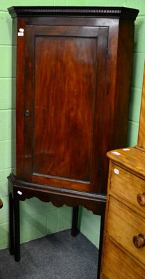 Lot 1249 - A mahogany corner cupboard on stand