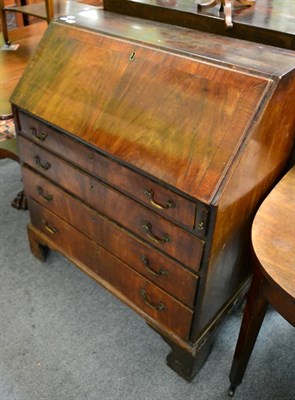 Lot 1256 - A Georgian mahogany bureau