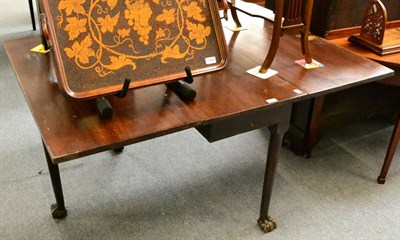 Lot 1267 - A George III mahogany gateleg table on ball and claw feet