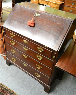 Lot 1269 - A George III oak bureau