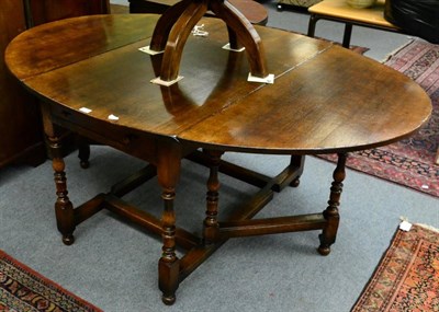 Lot 1273 - A Titchmarsh & Goodwin oak gateleg table, with two drawers, RL 42/AS, 183cm open, 74cm closed,...