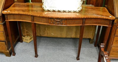 Lot 1288 - A mahogany serpentine fronted serving table