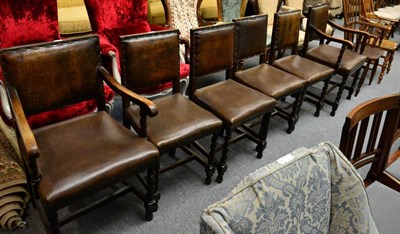 Lot 1314 - A set of six 1920's studded leather oak dining chairs including two carvers