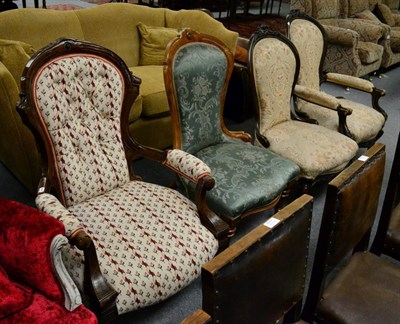 Lot 1317 - A Victorian nursing chair together with a gents button back open armchair