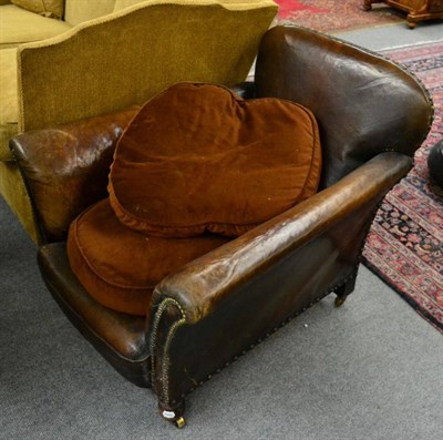 Lot 1321 - A studded leather tub chair