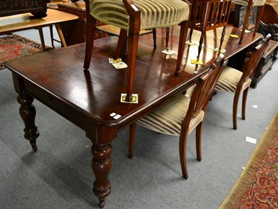 Lot 1325 - A Victorian mahogany wind out dining table with four additional leaves