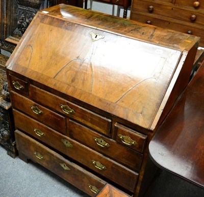 Lot 1329 - A George I walnut bureau