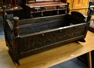 Lot 1336 - An early 19th century carved oak crib