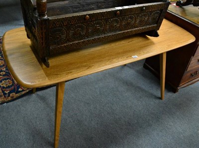 Lot 1337 - An Ercol light elm dining table