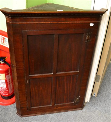 Lot 1363 - A George III mahogany hanging corner cupboard