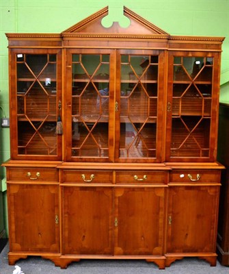 Lot 1373 - A reproduction astragal glazed yew wood display cabinet