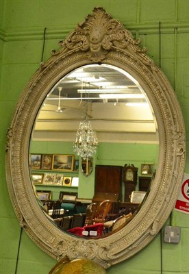 Lot 1377 - A Victorian style bevelled glass mirror, modern, the oval plate within a cream crackle painted...