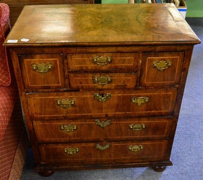 Lot 1388 - A George I walnut chest of drawers, two central short drawers flanked by a further pair of drawers