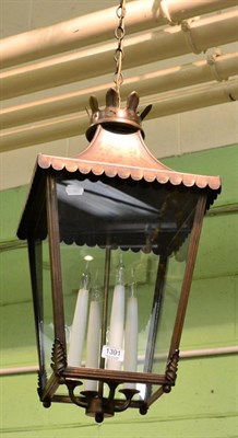 Lot 1391 - A Victorian style metal lantern with four candle holders