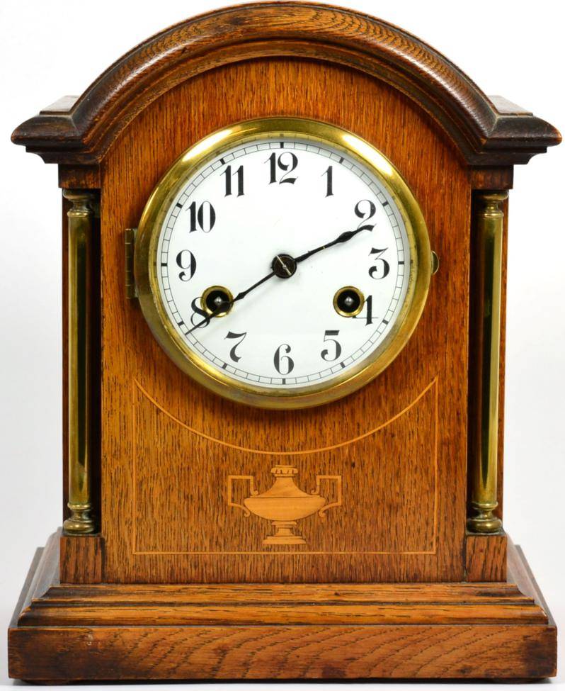 Lot 14 - An oak striking table clock, movement stamped Junghans