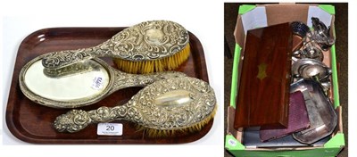 Lot 20 - A silver hand mirror and matching brushes; together with a quantity of silver plated flatware...