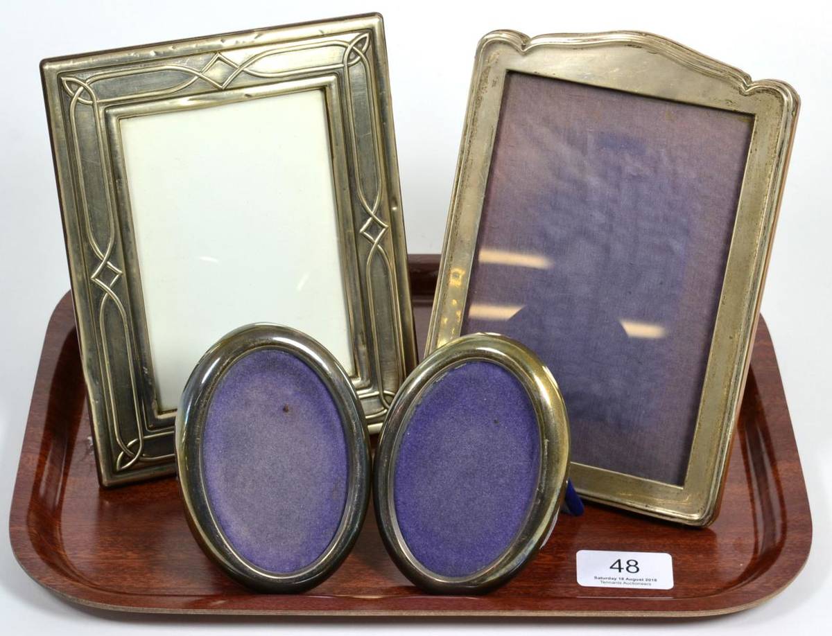 Lot 48 - Two rectangular silver photograph frames; and a smaller pair of oval examples (4)