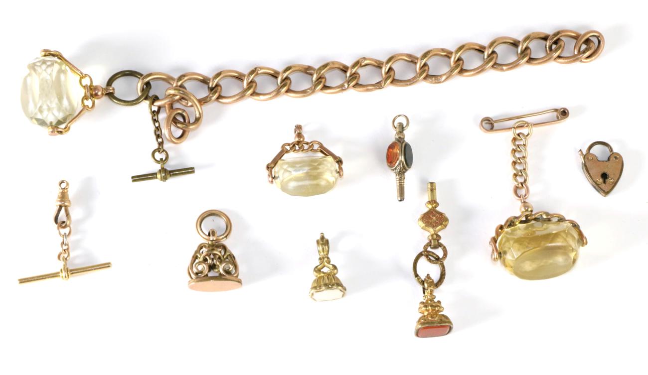 Lot 77 - Three 9 carat gold mounted swivel fobs; three 19th century fobs; two watch keys; and a t bar...