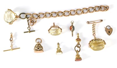 Lot 77 - Three 9 carat gold mounted swivel fobs; three 19th century fobs; two watch keys; and a t bar...
