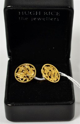 Lot 81 - A pair of Chinese cufflinks, pierced circular plaques with a dragon motif, to swivel bars,...