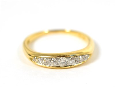 Lot 98 - A diamond ring, seven graduated old cut diamonds to a lozenge-shaped shank, total estimated diamond