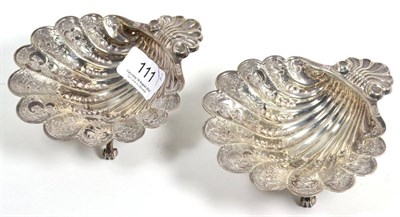 Lot 111 - A pair of silver shell shaped dishes