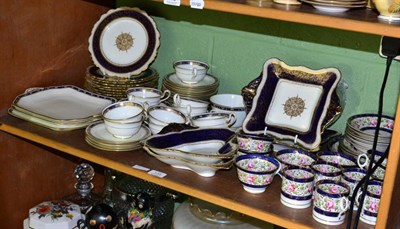 Lot 135 - A Paragon china part dessert service, white ground with cobalt blue borders and gilt...