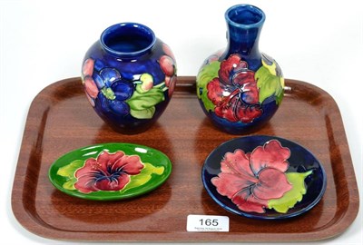 Lot 165 - Four Moorcroft vases/dishes, Hibiscus and Clematis pattern