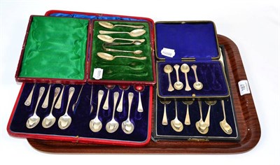 Lot 167 - A set of twelve silver teaspoons and tongs, with shell terminals, in a fitted case; together...