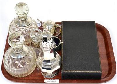 Lot 176 - A silver octagonal caster; silver mounted glass scent bottles; condiment set; pencils; tea...