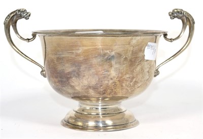 Lot 177 - A twin handled silver pedestal bowl, Birmingham 1925, with flying lion's head handles, 15.5cm...