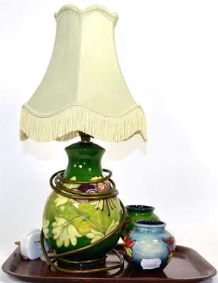 Lot 187 - Moorcroft lamp and two matching vases