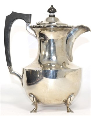 Lot 190 - A silver hot water pot, James Dixon & Sons, Sheffield, 1933, of baluster form with ebonised...