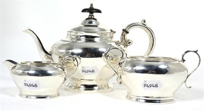 Lot 192 - An Edwardian silver three-piece bachelor's teaset, by Levesley Brothers, Sheffield 1905,...