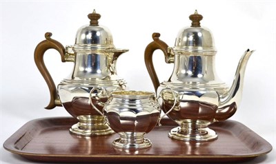 Lot 206 - A silver three piece coffee service, Edward & Sons, Glasgow 1936, the coffee pot 18cm high, 31.1ozt