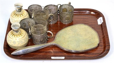 Lot 215 - A silver and shagreen hand mirror; a set of six white metal filigree tea glass holders; and a...