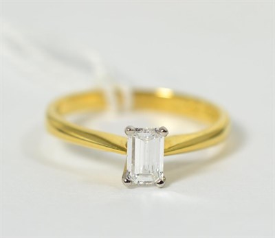 Lot 254 - An 18 carat gold octagonal cut solitaire diamond ring, in a claw setting, to knife edge...