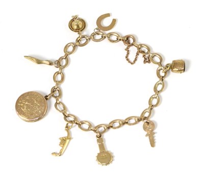 Lot 260 - A fancy link charm bracelet, suspending eight various charms