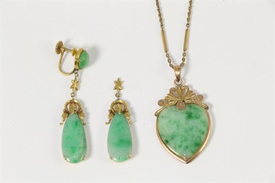 Lot 264 - A jade pendant necklace, a heart-shaped jade plaque in a fancy frame and on a long and short...