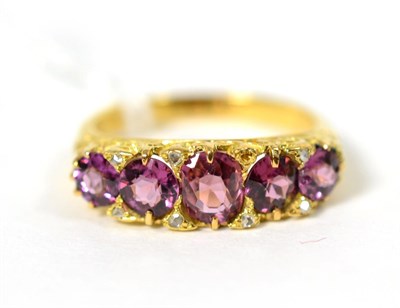 Lot 271 - A pink stone and diamond ring, graduated oval and round pink stones spaced by rose cut diamond...