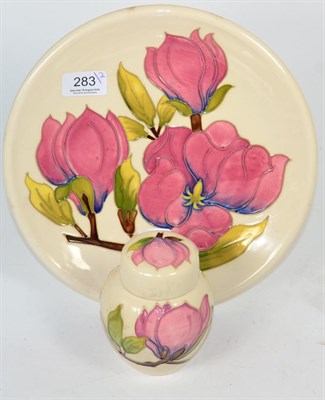 Lot 283 - Moorcroft Magnolia pattern plate and a matching ginger jar and cover