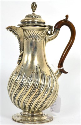 Lot 285 - A Victorian silver hot water jug, Charles Stuart Harris, London 1890, baluster part fluted with...