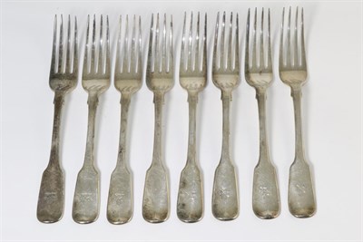 Lot 308 - A set of eight George IV silver fiddle pattern table forks, John Hawkins, London 1827, all but...