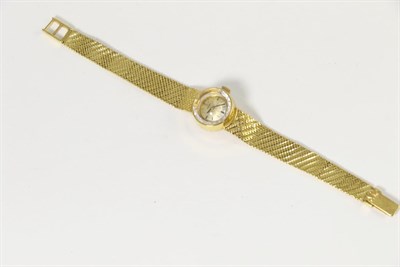 Lot 319 - An 18 carat gold Omega lady's wristwatch with link strap, 1.5cm dial