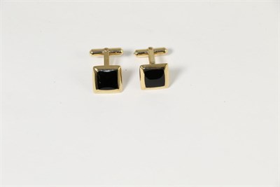 Lot 325 - A pair of 9 carat gold onyx cufflinks, square onyx plaques to rounded frames, with swivel backs