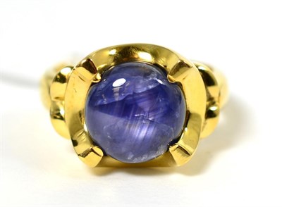 Lot 326 - An 18 carat gold star sapphire ring, a circular star sapphire in an extended claw setting and...